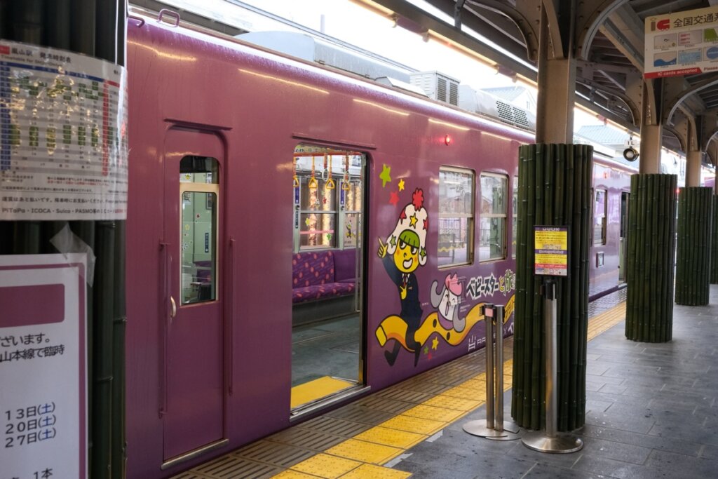 Randen tram wrapped with Oyatsu Company advertisement